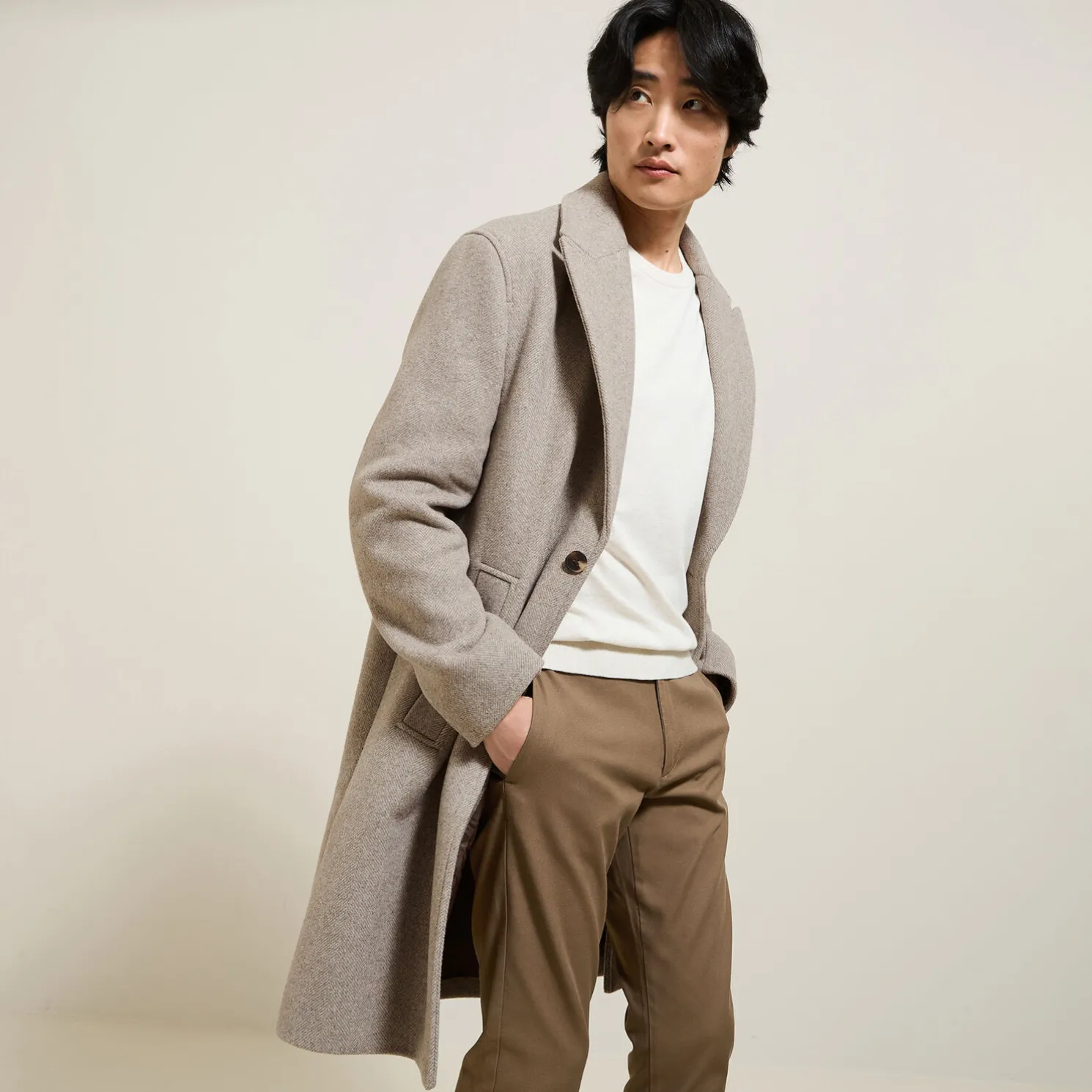 Lange mantel met visgraatmotief en reverskraag