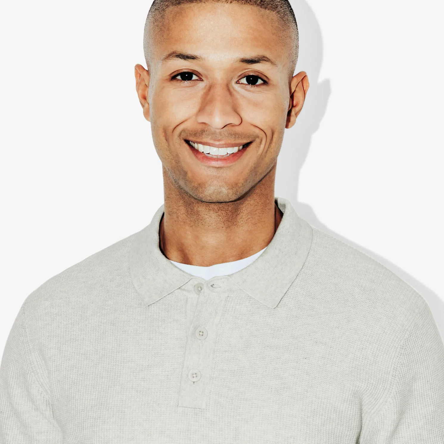 Polo met knopen in textuurstof